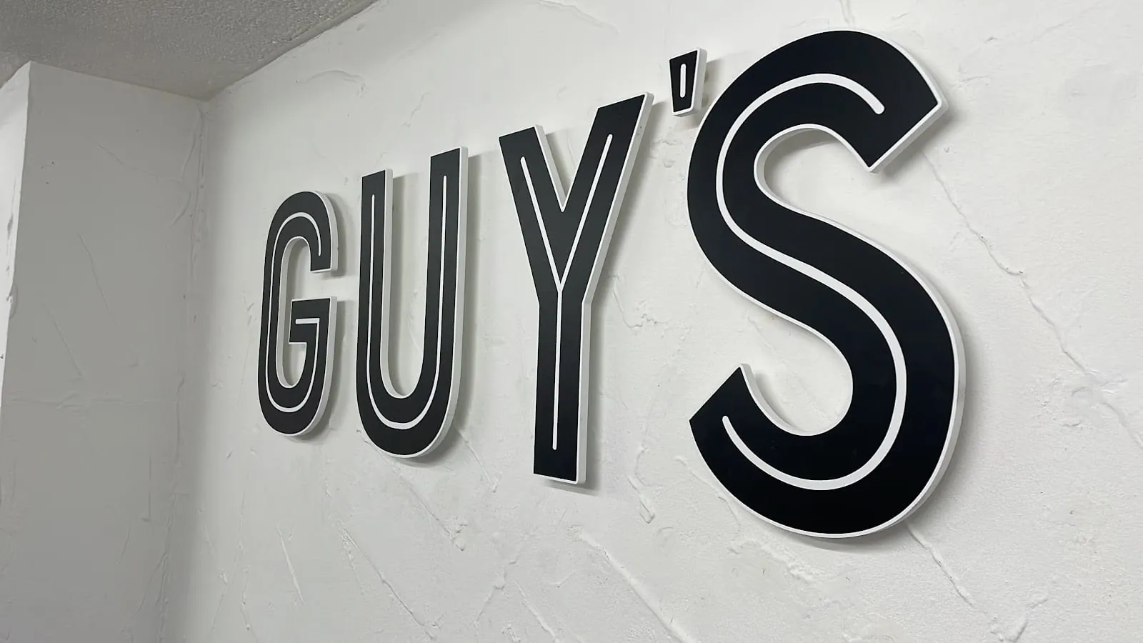 The Guy’s Barbershop sign inside the shop